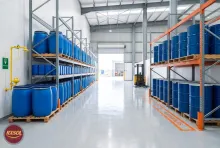 Descaling liquid drums and jerry cans on pallets beside a separate white spirit bay in a Barka warehouse, Oman